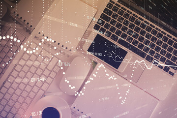 Multi exposure of data theme drawing hologram over topview work desk background with computer. Concept of technology.
