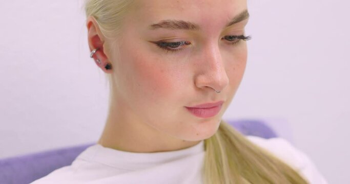 Professional holding the jewel of piercing day just before screw the ball. Tragus type.