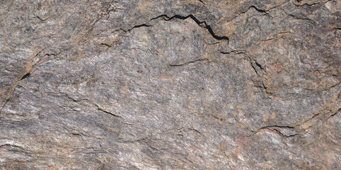 Textura de pedra lascada com relevos de tons cinzentos