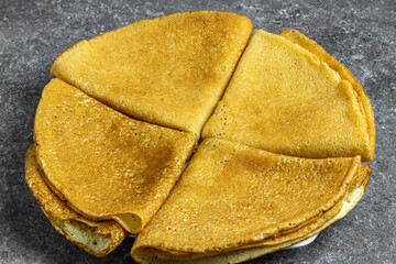 Traditional Russian pancakes on a plate close-up