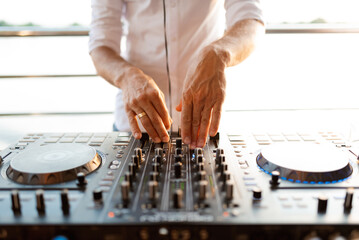 Hand on a mixer, operating the leader