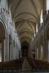 Fototapeta na wymiar The interior of the women's abbey Eglise de la Trinite de Caen or Abbaye aux Dames de Caen, Caen, Normandy, France