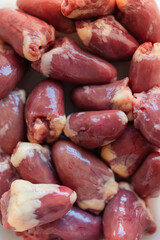 Raw, uncooked chicken or turkey hearts for cooking or barf feeding your cat or dog, protein and vitamin B rich organ meat or giblets fresh from poultry butcher,selective focus - 531809892