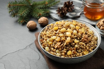 Traditional Christmas slavic dish kutia served on black table. Space for text