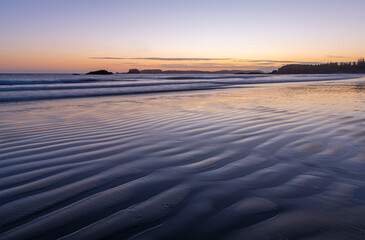 Sand ripples at sunset on Chesterman beach with long exposure, Tofino, Vancouver Island, British Columbia, Canada.