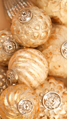 Christmas balls background.Golden christmas balls set.Festive shiny background in Gold tones.design Christmas decorations.Christmas toys in a minimalistic style and monochrome color. 