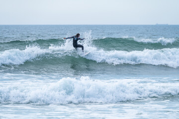 Surfer girl riding a wave