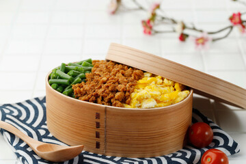 Three Color Japanese Rice Lunchbox with Stir Fry Minced Chicken, Boiled French Beans, and Scramble Eggs.