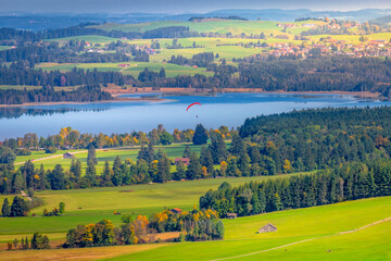 Fototapeta na wymiar Bavaria countryside with lake, farms and village near Fussen, German Alps