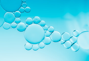 Oil bubbles pattern on blue gradient  background..