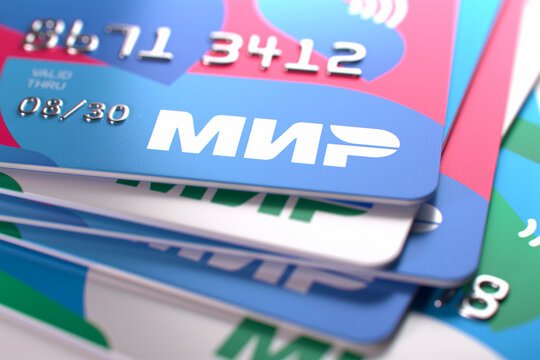 Close-up of several Russian MIR plastic bank cards in different colors. MIR credit bank cards, selected focus. Moscow, Russia - September 19, 2022