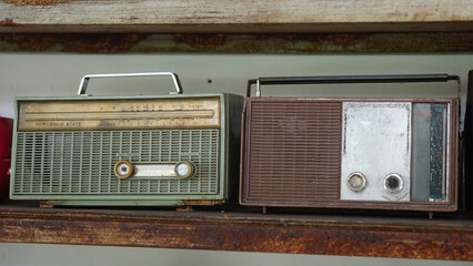 Old radio on the shelf. Focus selected