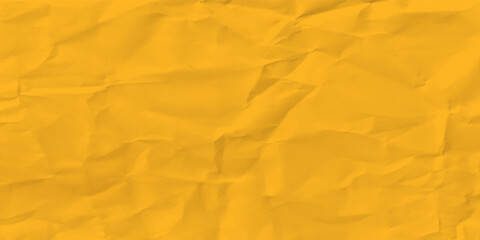 Yellow wrinkled paper texture background. Crumpled blank sheet of paper