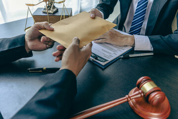 An attorney or officer accepts bribes from clients in the courtroom. Taking bribes to gain an...