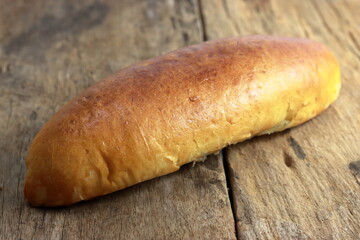 Healthy homemade fish bun on old wooden table. Home made bun