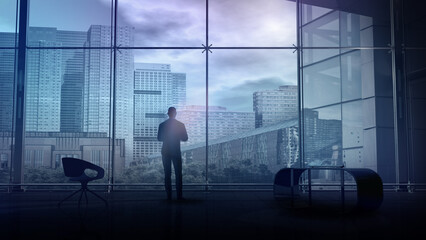 Fototapeta na wymiar In a spacious office, a man stands and looks at city buildings, 3D render.