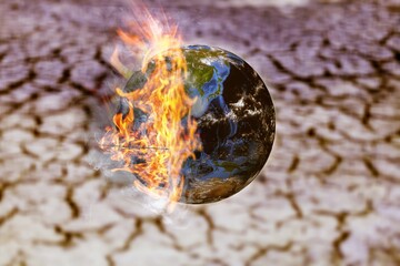 Fire burn earth globe on nature background. Collapse concept.