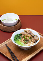 Mie ayam ceker (Chicken noodle with tasty chicken feet), Indonesian street food consist of noodle, vegetables, chicken meat and chicken feet. Popular food in the country