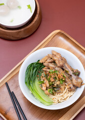 Mie ayam ceker (Chicken noodle with tasty chicken feet), Indonesian street food consist of noodle, vegetables, chicken meat and chicken feet. Popular food in the country