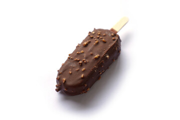 human hand on chocolate ice cream stick and nuts