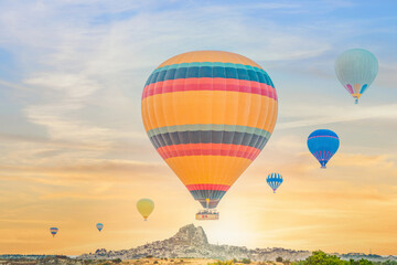 Fototapeta na wymiar hot air balloons over Goreme town in Cappadocia Turkey during morning of sunrisie