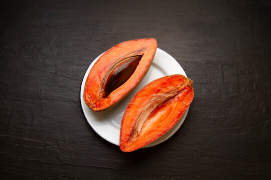 Mexican fruit called mamey on dark background