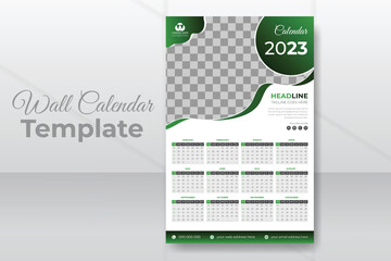 Monthly wall calendar design template for 2023 with abstract green color shapes. Week starts from Sunday. Modern and minimal wall calendar for 2023 with white background