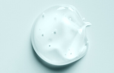 A drop of liquid gel or cosmetic serum or cleansing lotion against acne.