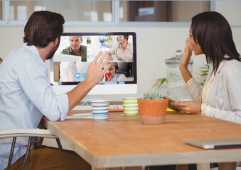 Rear view of people during a visio call on computer at home