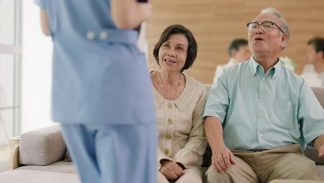 Elderly people healthcare tech and prescription online concept.asian senior people listening to young nurse or doctor explaining therapy treatment effect and how to take pills in a nursing home.