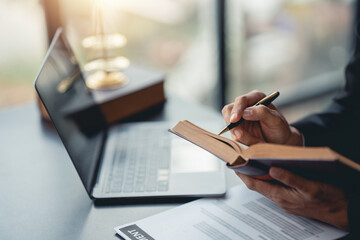 Businessman and lawyer look at contract terms in law, discuss contract document. Treaty Law. Signing a business contract, signing important document.