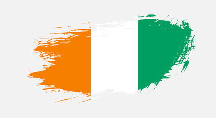 Free hand drawn grunge flag of Cote dIvoire on isolated white background