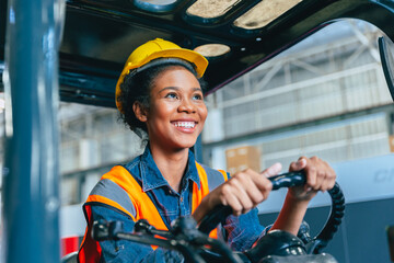 Women labor worker at forklift driver happy smile enjoy working in industry factory logistic shipping warehouse.