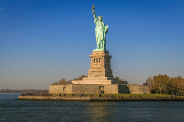 Fototapeta premium Statue of Liberty and clear sky at sunset, New York City, United States