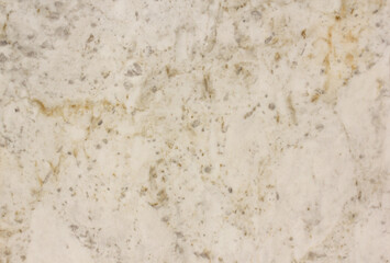 The front section of the granite rock is beige .