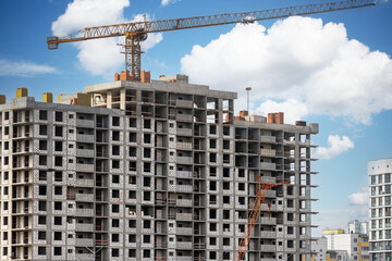Fototapeta premium Monolithic frame construction of the building. Solid walls of concrete. The framework for the walls. Formwork for walls made of concrete. Construction site close up.