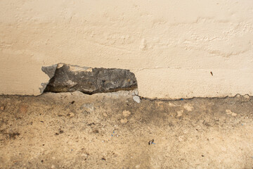 Broken concrete buildings, cracked walls, slabs come out.