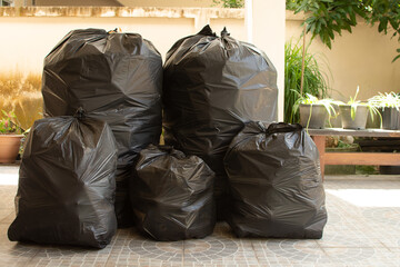 Pile of black garbage on the footpath at side road in big city set 3