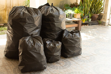 Pile of black garbage on the footpath at side road in big city set 2