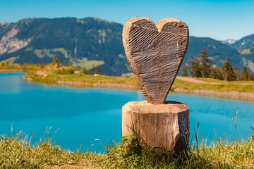 Details of a carved wooden heart on a sunny summer day at Fieberbrunn, Tyrol, Austria