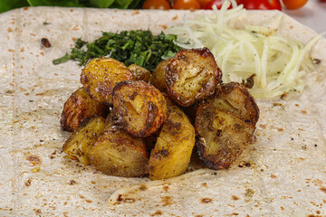 Baked potato with various herbs