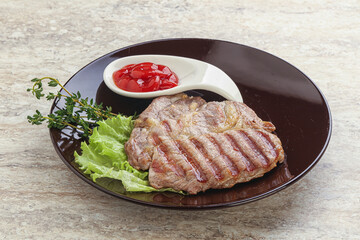 Grilled pork neck steak with ketchup