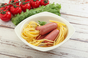Mini sausages with pasta spaghetti