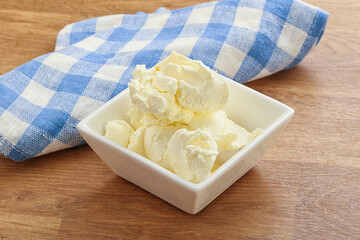 Italian soft mascarpone cheese in the bowl