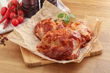 Marinated chicken leg in tomato sauce