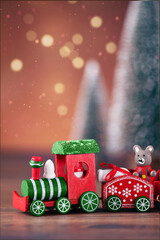 Red Christmas toy train. Christmas greeting card. Christmas background with copy space.