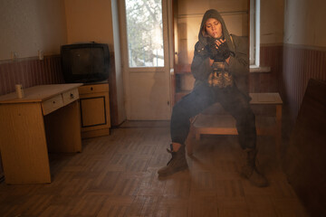 Environmental disaster. Post apocalyptic female survivor smoking in abandoned building. A lonely...