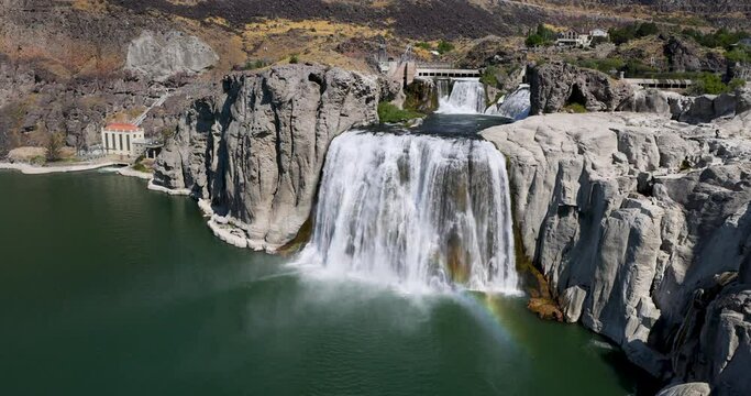 Snake River Waterfall rainbow Twin Falls Idaho slow. Shoshone Falls waterfall on the Snake River, Idaho. Irrigation and hydroelectric power stations is economic impact to west.