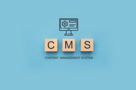 CMS Content Management System banner. CMS Block letters on blue background. Cms written on a wooden cubes. website management software, internet technology concept.