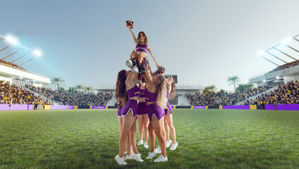Group of cheerleaders in action on  stadium
